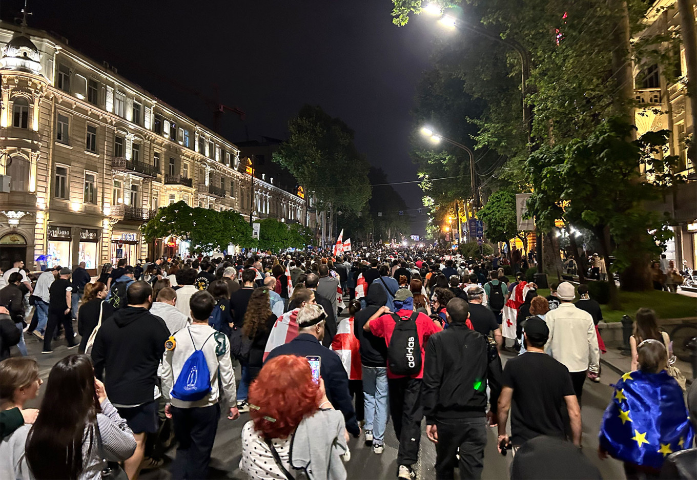 
					Demonstrators march down Tbilisi’s main thoroughfare Rustaveli Avenue.					 					MT				