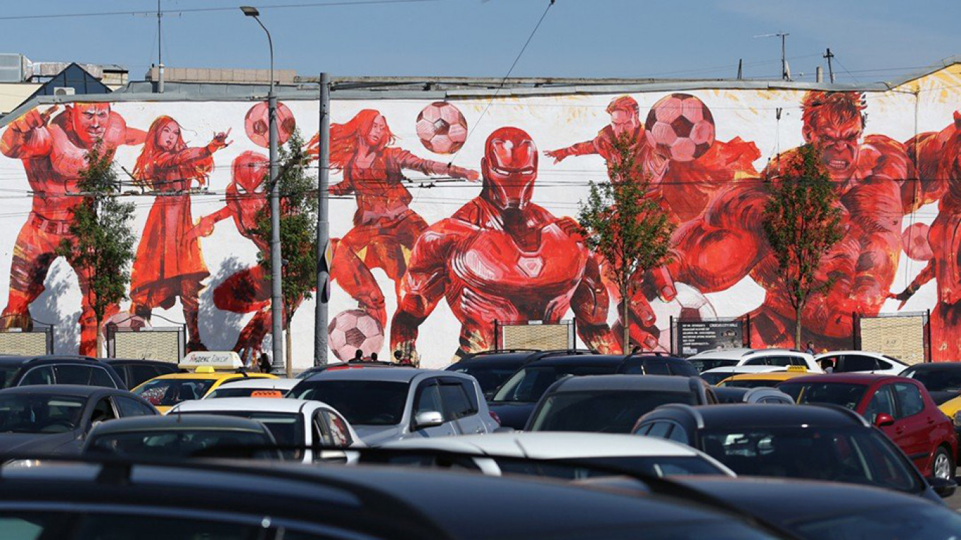 
					Martin Ron's mural of footballing superheroes.					 					Andrei Nikerichev / Moskva News Agency				