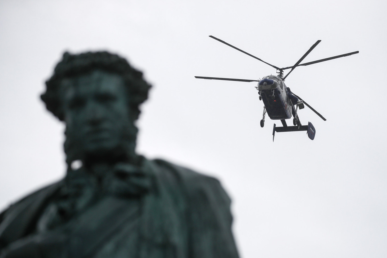 
					A helicopter circled the protest route in Moscow Saturday afternoon.					 					Valery Sharifulin / Tass				