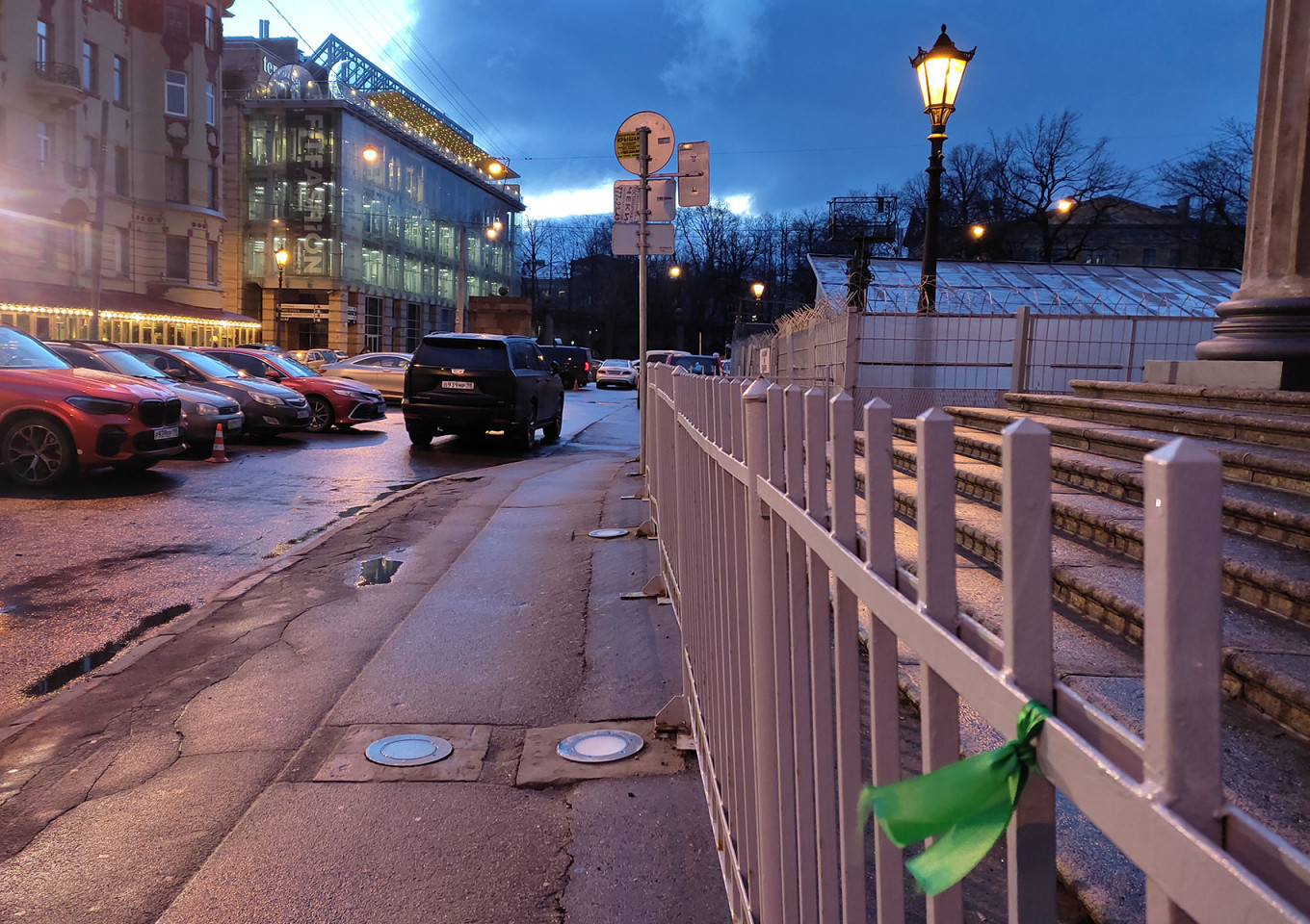 
					A green ribbon tied to a fence near the Kazan Cathedral in St. Petersburg.					 					MT				