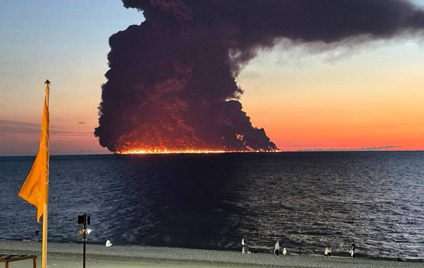 
					Smoke rises from the tanker Aframax Rio that caught fire after coming under attack on Oct. 6.					 					Social media				