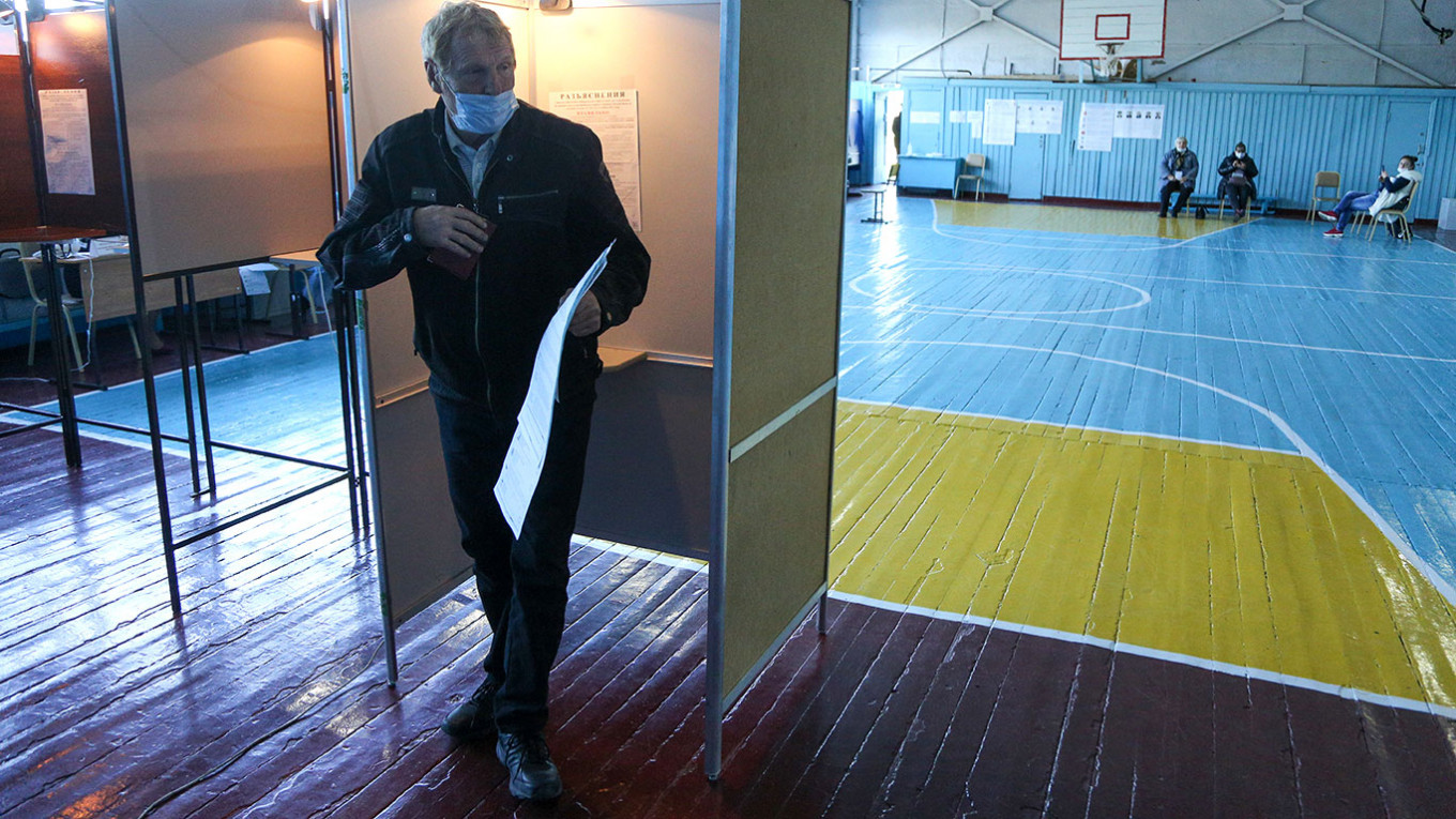 
					A man votes in the 2021 Russian parliamentary election in the village of Nikolayevka, Omsk region.					 					Yevgeny Sofiychuk / TASS				