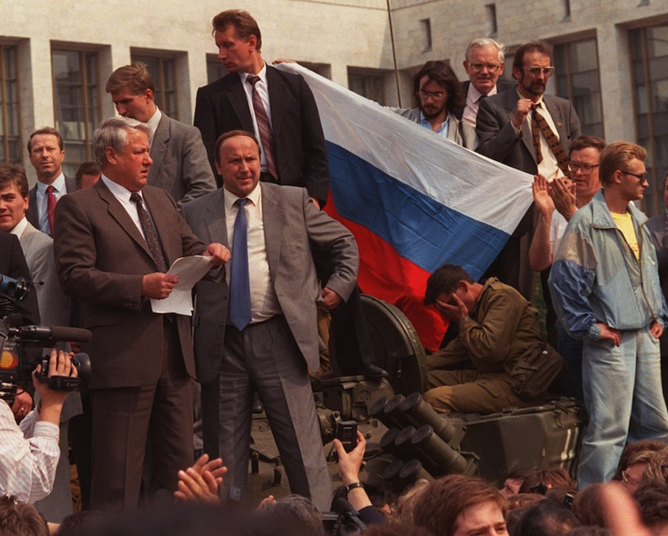 
					 Boris Yeltsin with his bodyguard Alexander Korzhakov preparing to read the historic appeal to Russians on Aug. 19, 1991					 					AP				
