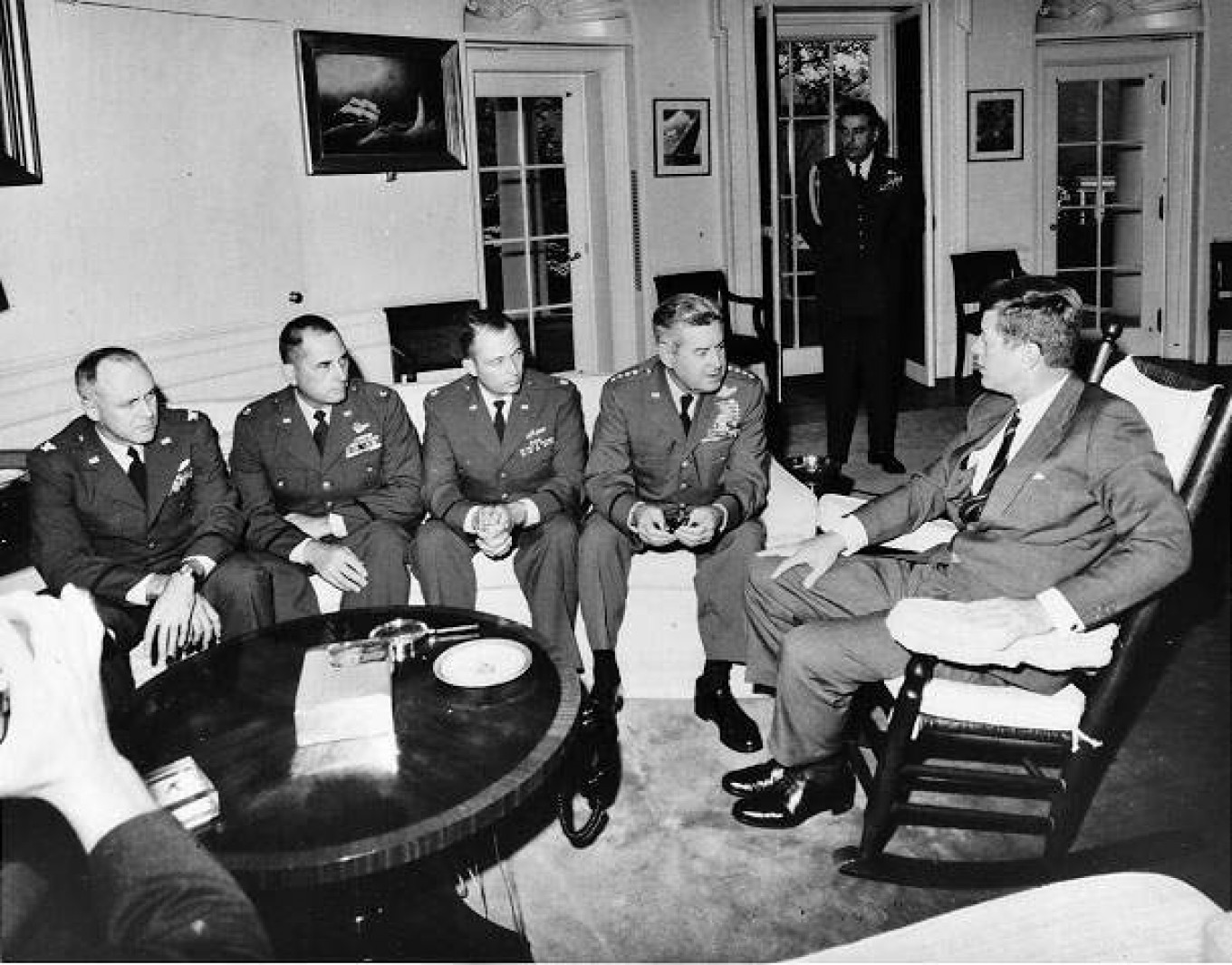 
					President Kennedy meets in the Oval Office with General Curtis LeMay and reconnaissance pilots who flew the Cuban missions.					 					U.S. Central Intelligence Agency				