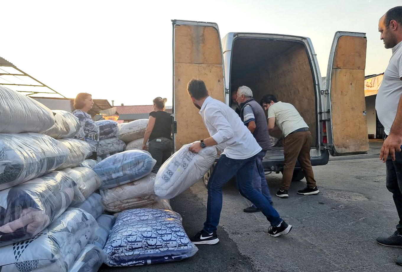 
					Unloading humanitarian aid in Goris.					 					Ethos				