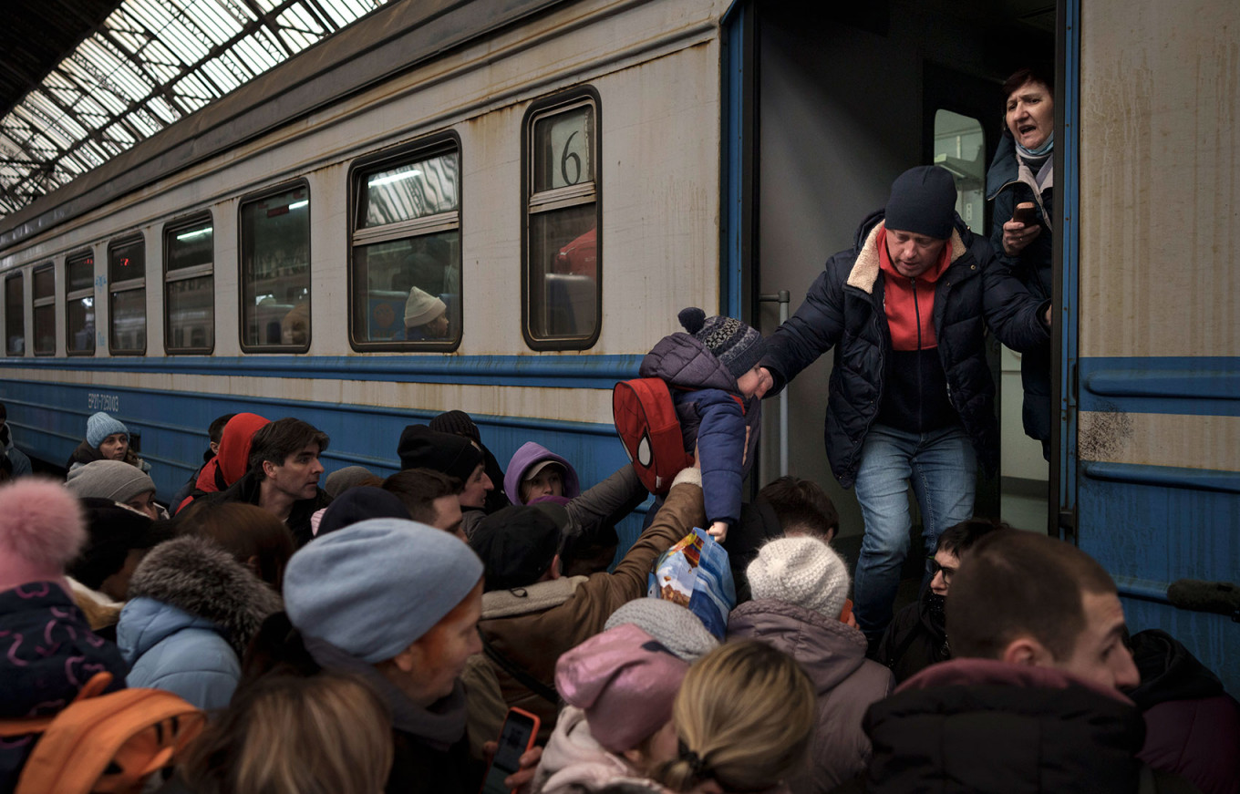 In Photos: Ukrainians Flee to Europe as War Rages