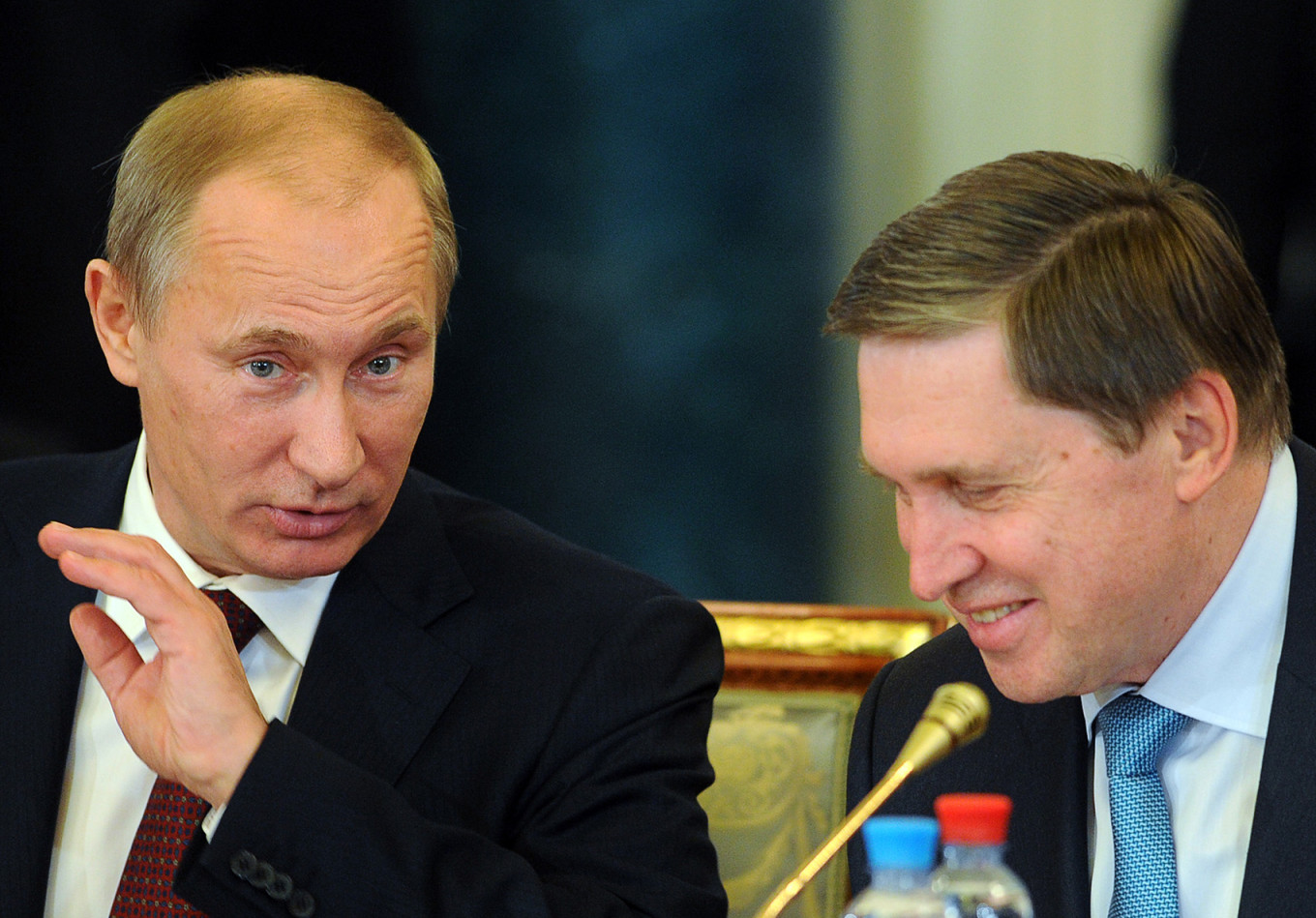 
					Russian Prime Minister Vladimir Putin and deputy government chief of staff Yury Ushakov in 2011.					 					Artyom Korotayev / TASS				