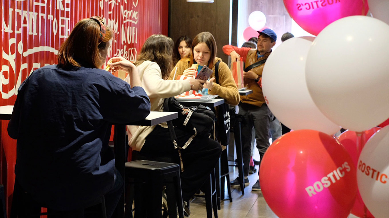 
					Customers eating in the dining area.					 					MT				