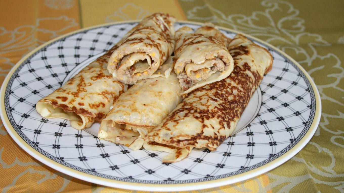 
					Rolled filled blinis.					 					Pavel and Olga Syutkin				