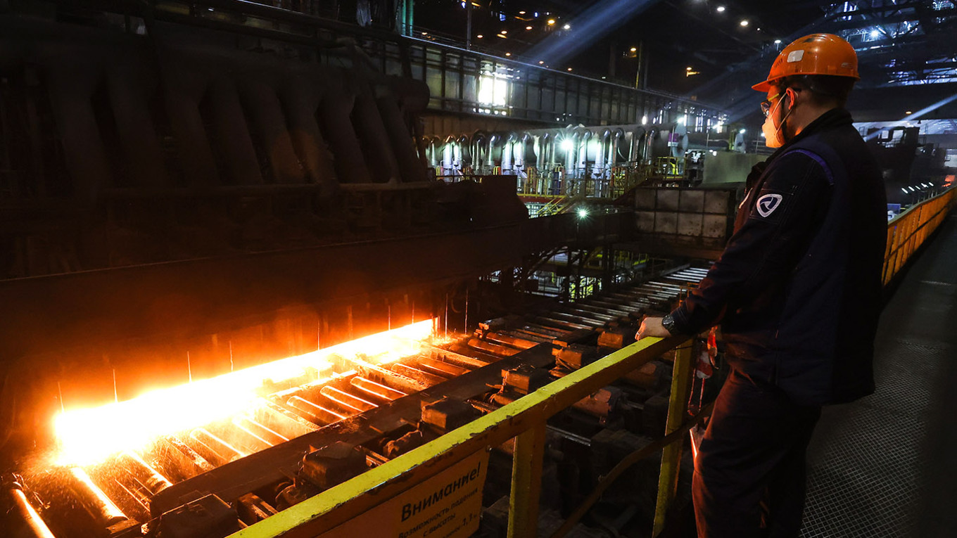 
					A man works at Cherepovets Steel Mill in Cherepovets.					 					Sergei Karpukhin / TASS 				