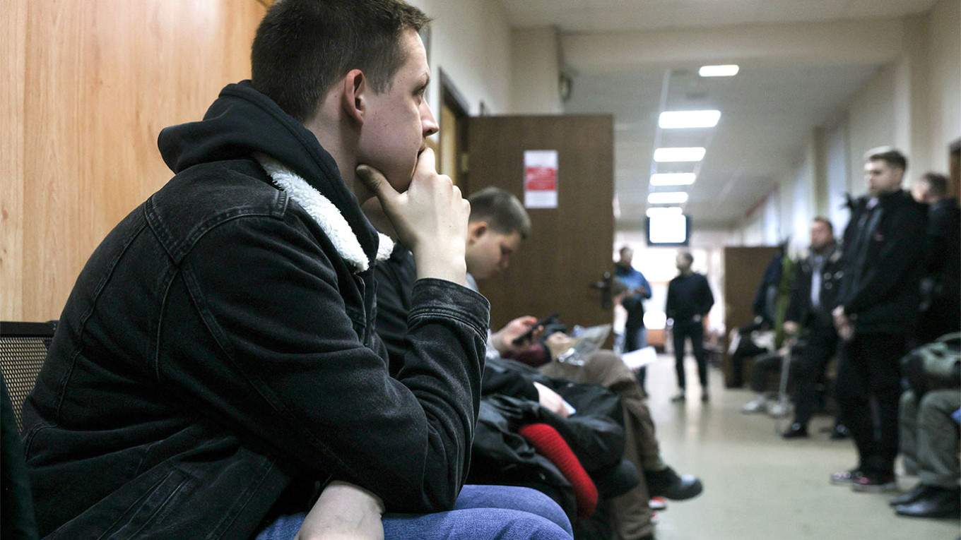 
					Russian conscripts wait in line to undergo medical examination.					 					 Alexander Shcherbak / TASS				