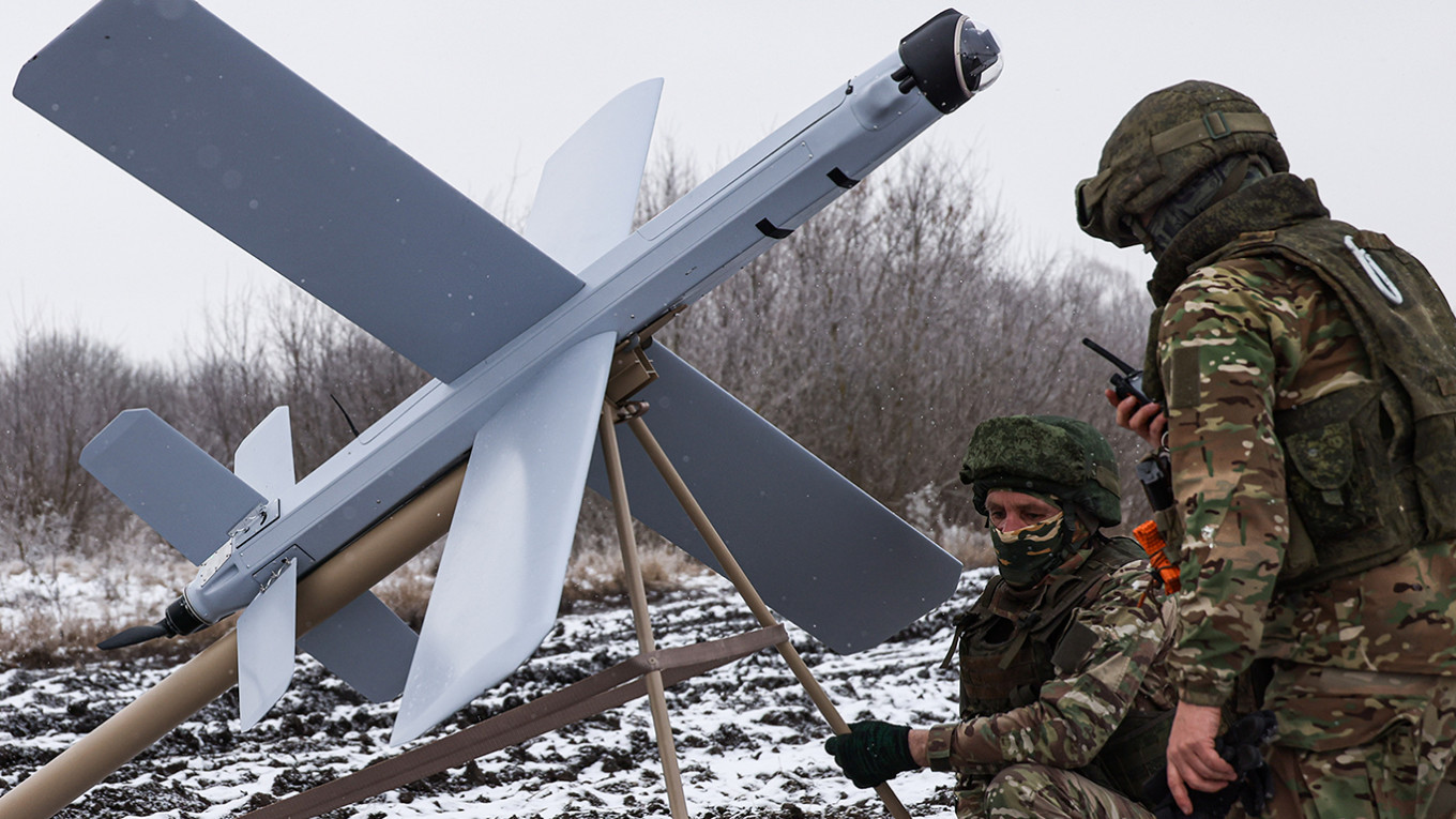 
					Russian servicemen prepare to launch a Lancet loitering munition in the Kursk region.					 					Vladimir Gerdo/TASS				