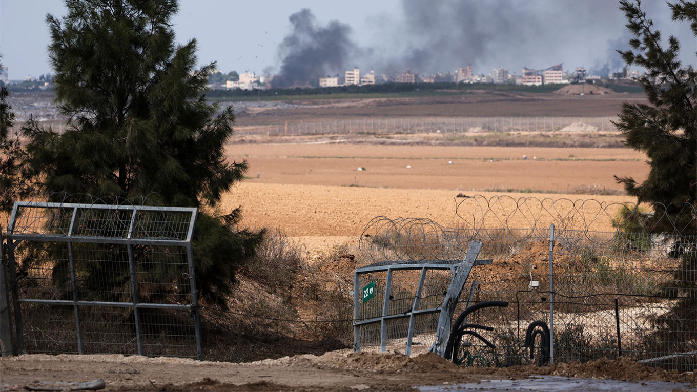 The broken gate of Kibbutz Kfar Aza in southern Israel, which was breached by militants from Hamas. Thomas Coex / AFP
