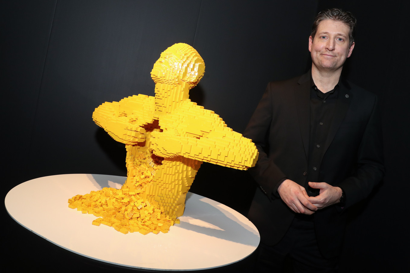 
					Sawaya poses beside his “Yellow” sculpture, which was used by Lady Gaga in the video for her song “G.U.Y.”					 					SERGEI ULYANOV				