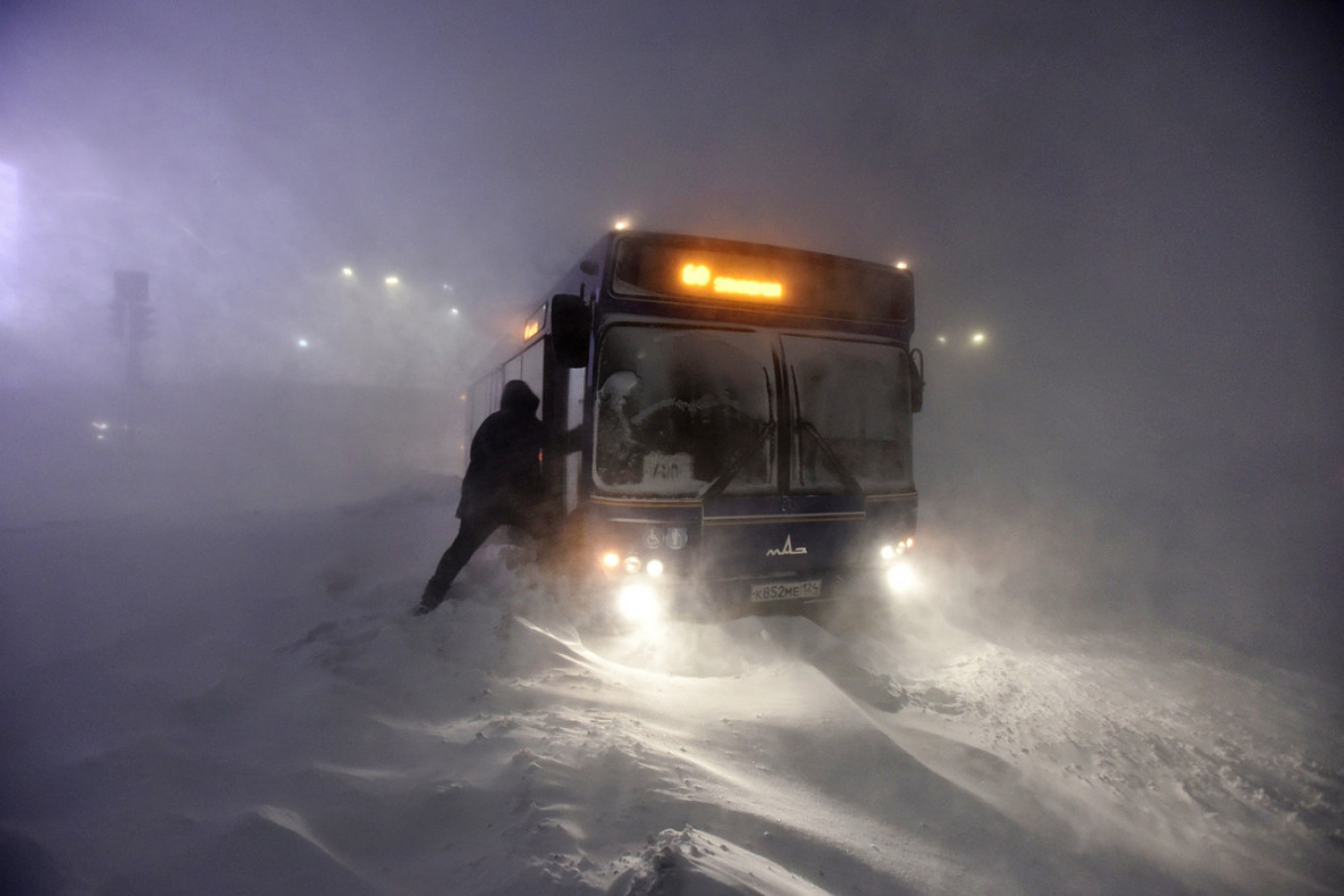 
					A bus gets stuck in a snowdrift in Norilsk.					 					Taimyr Telegraph				
