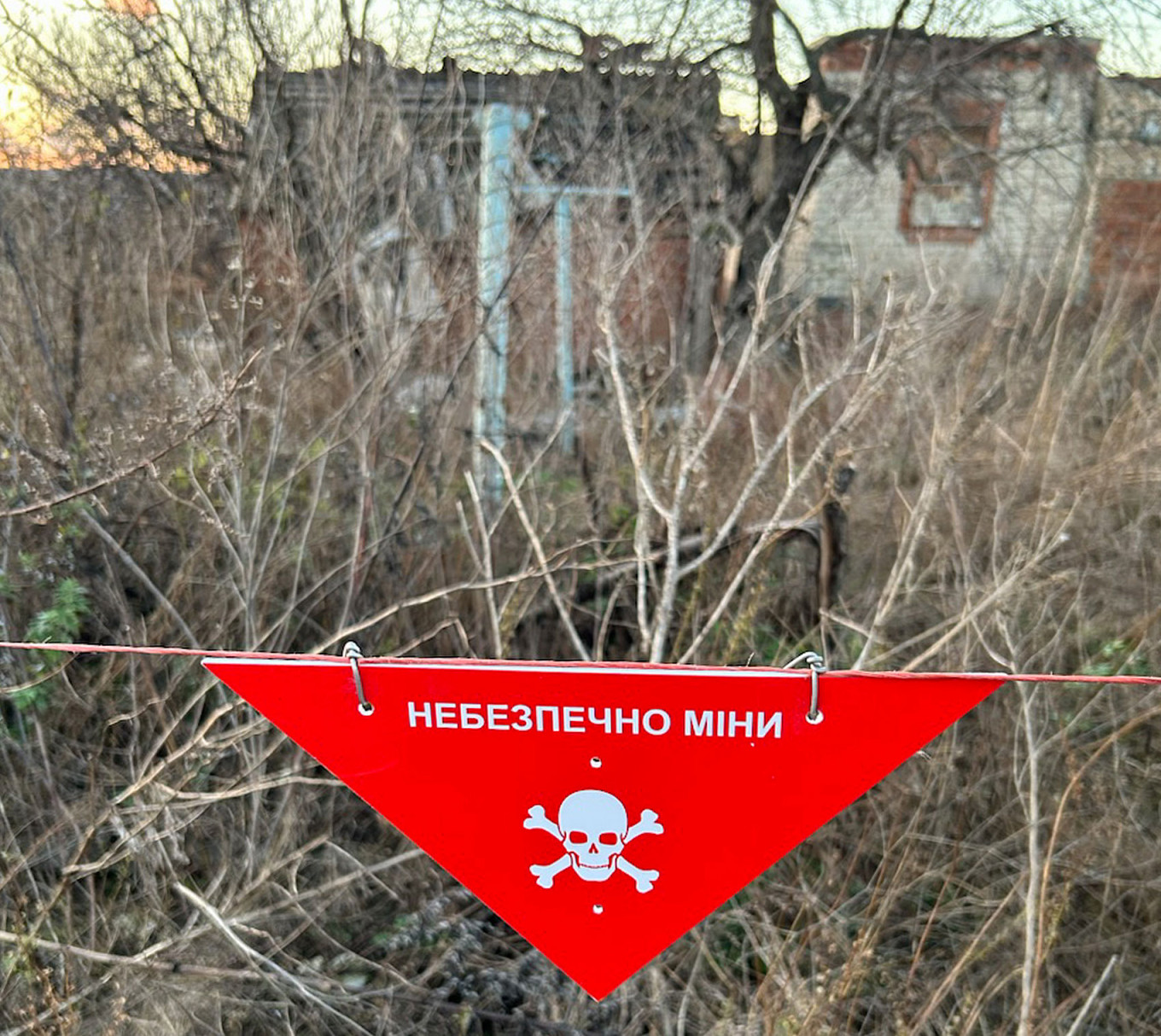 
					A sign warns of landmines on the roads of Kam’yanka.					 					Joshua Robert Kroeker				