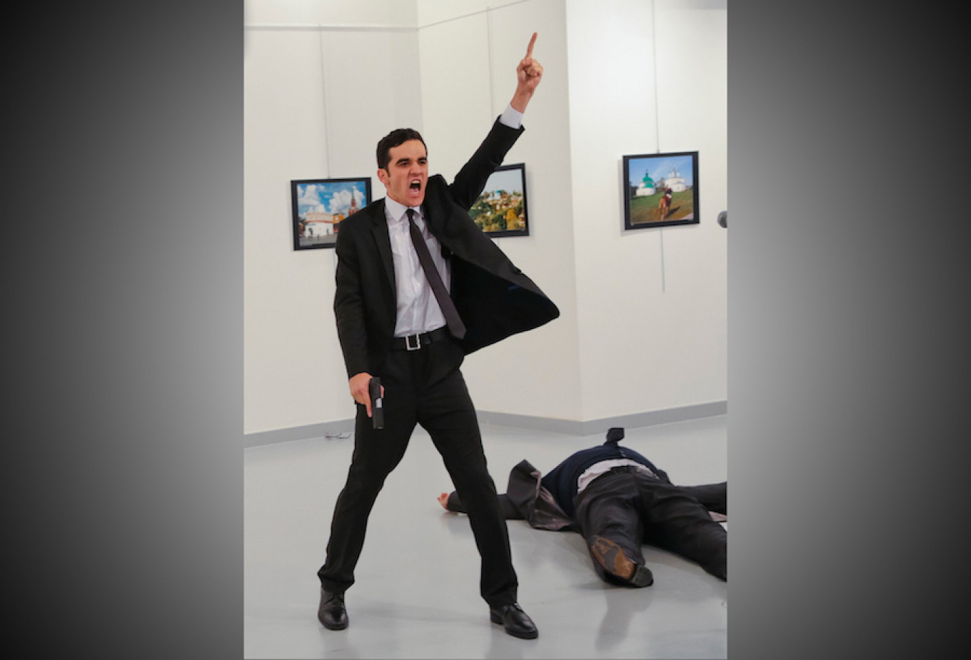 
					In this Dec. 19, 2016 file photo, Mevlut Mert Altintas shouts after shooting Andrei Karlov at an art gallery in Ankara, Turkey.					 					Burhan Ozbilici / AP				