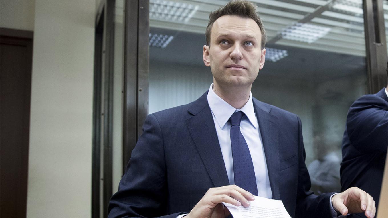 Russian Police Search Navalny’s Apartment, HQ – Aides – The Moscow Times