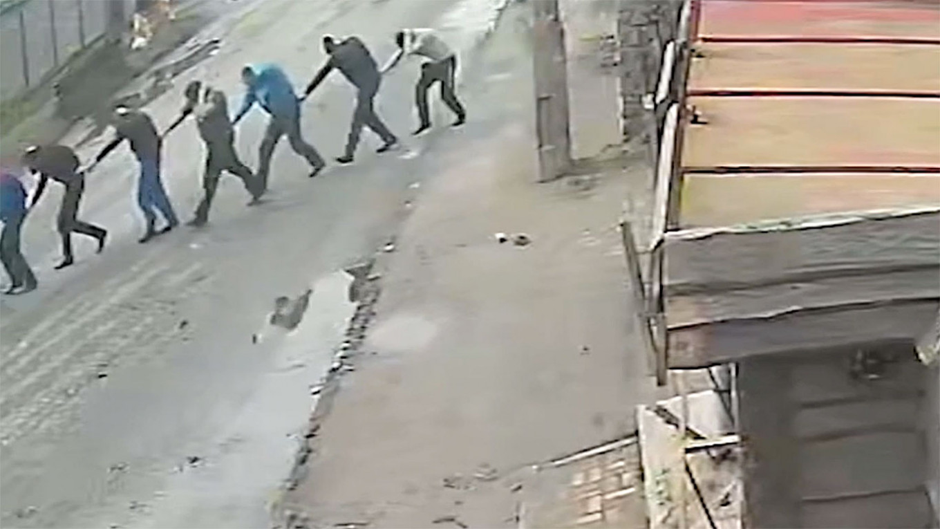 
					Screen grab CCTV camera footage, showed Russian soldiers leading a group of Ukrainian captives toward the courtyard where they would be executed moments later on March 4.					 					nytimes.com				