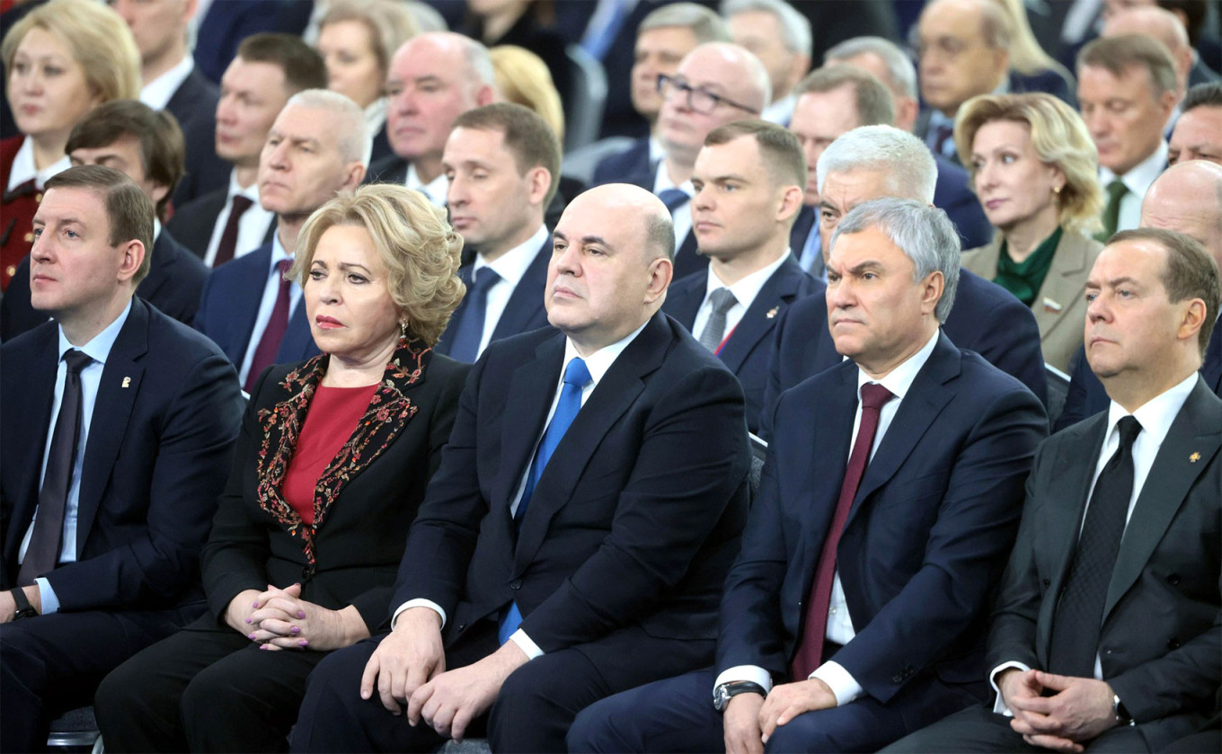 
					Russian officials listen to Russian President Vladimir Putin's state-of-the-nation address.					 					kremlin.ru				
