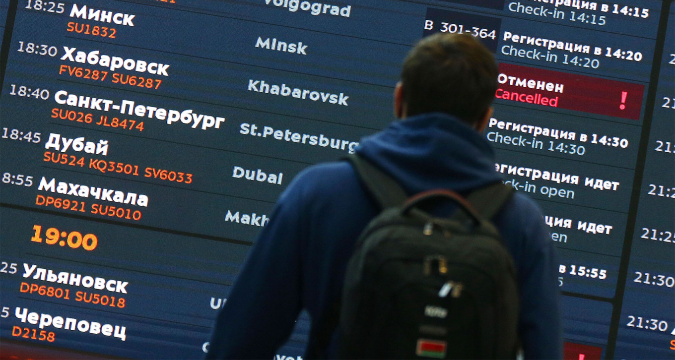 
					Departure board at a Moscow airport. 					 					Sergei Vedyashkin / Moskva News Agency				