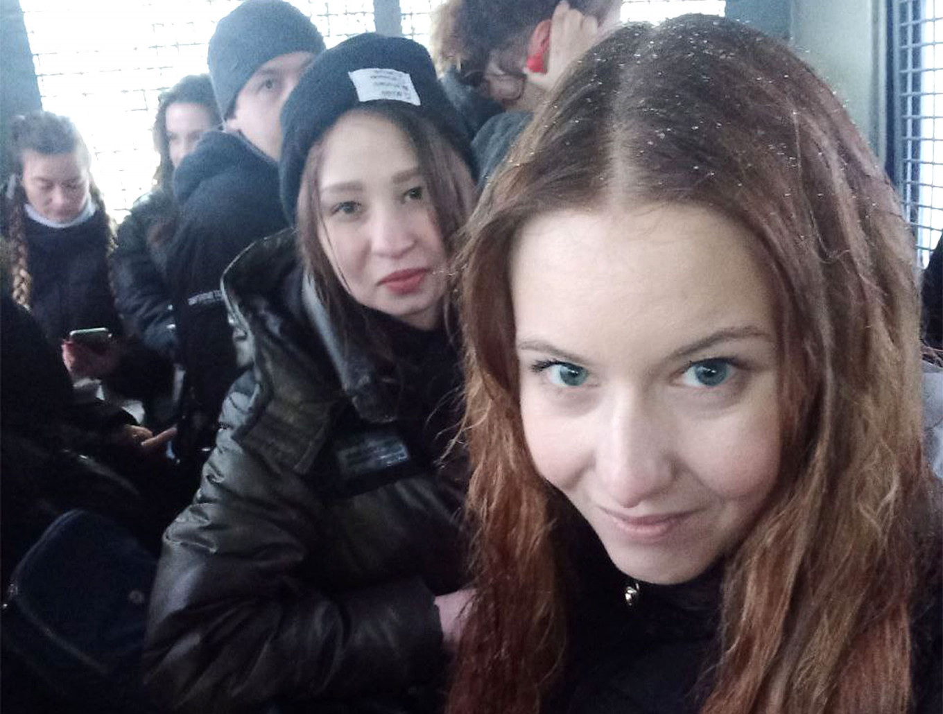 
					Natalia Tikhonova (R) in a police vehicle.					 					Courtesy photo				