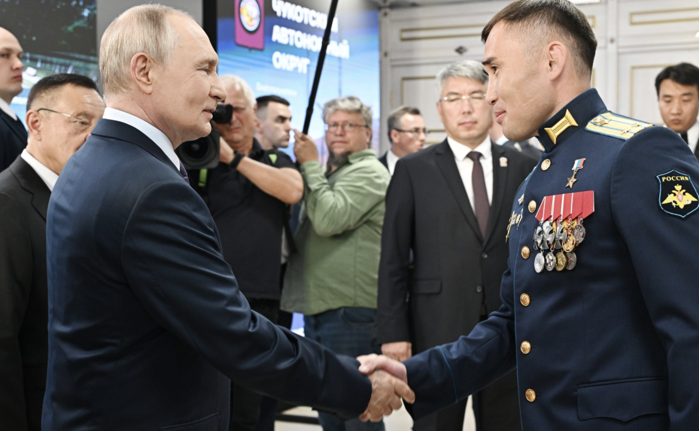
					Putin meets Lieutenant Colonel Dashibal Munkozhargalov, a participant in the Kremlin’s “Time of Heroes” program, which aims to place veterans of the war in Ukraine in government positions, in Ulan-Ude.					 					Kremlin.ru				