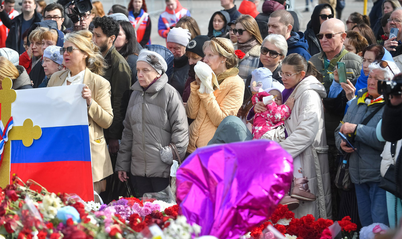 
					Memorial service for those killed in the attack at Crocus City Hall at a makeshift memorial.					 					Sergei Kiselev / Moskva News Agency				
