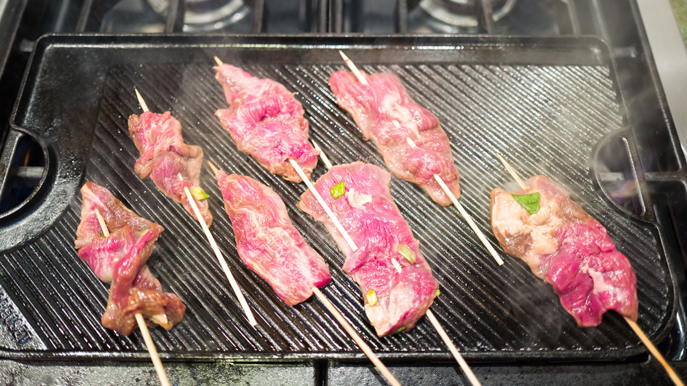 Shashlik or shashlyk (meaning skewered meat) was originally made of lamb.  Nowadays it is also made of pork or beef depending on local preferences and  Stock Photo - Alamy