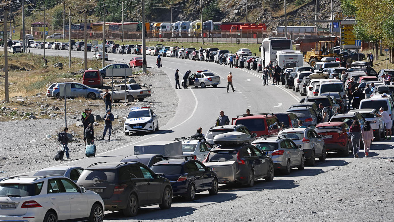 
					ars wait in line on the road for the Verkhny Lars checkpoint on the Russian-Georgian border in September 2022.					 					 Valery Sharifulin / TASS				