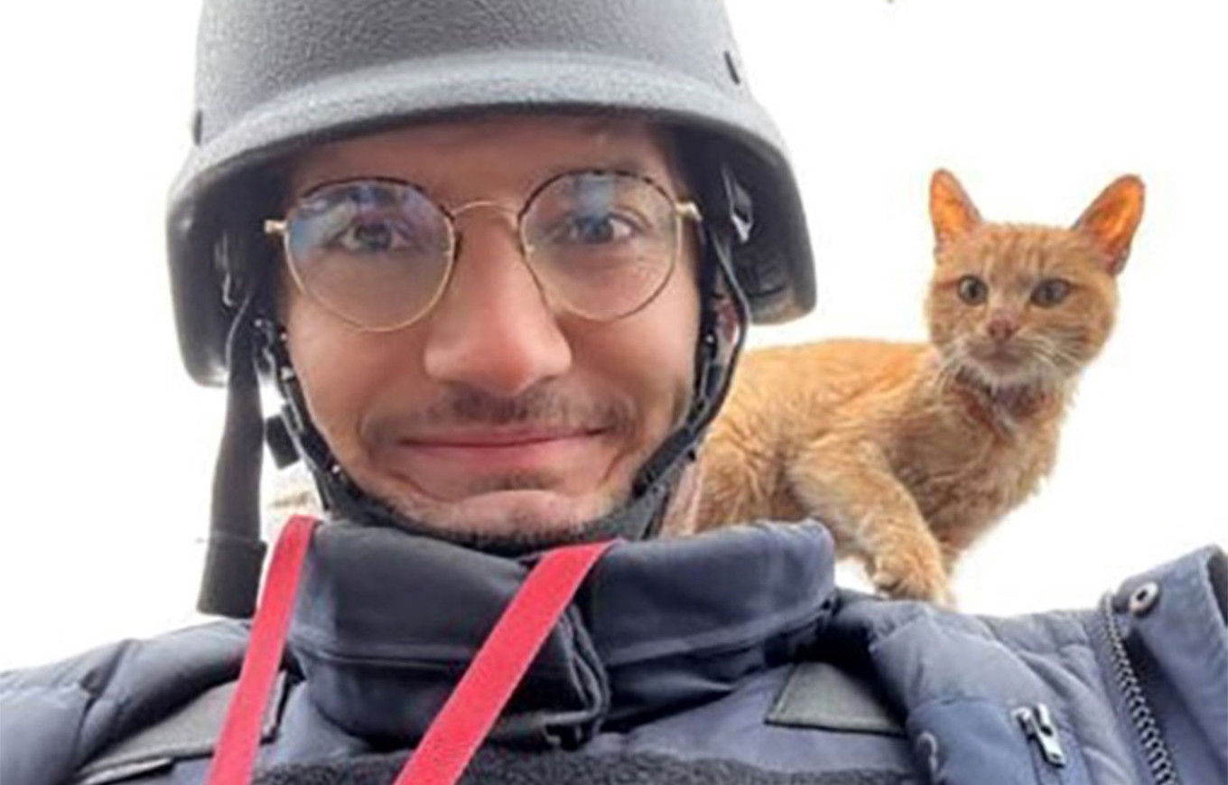 
					AFP journalist Arman Soldin snaps a selfie with a cat on his shoulder during an assignment for AFP in Ukraine. 					 					Arman Soldin / AFP				