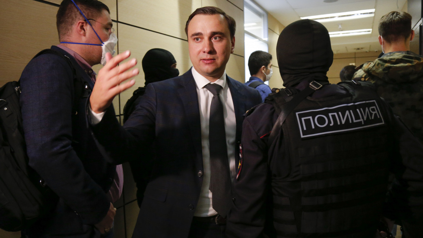 Russian police raid Navalny's home, offices 