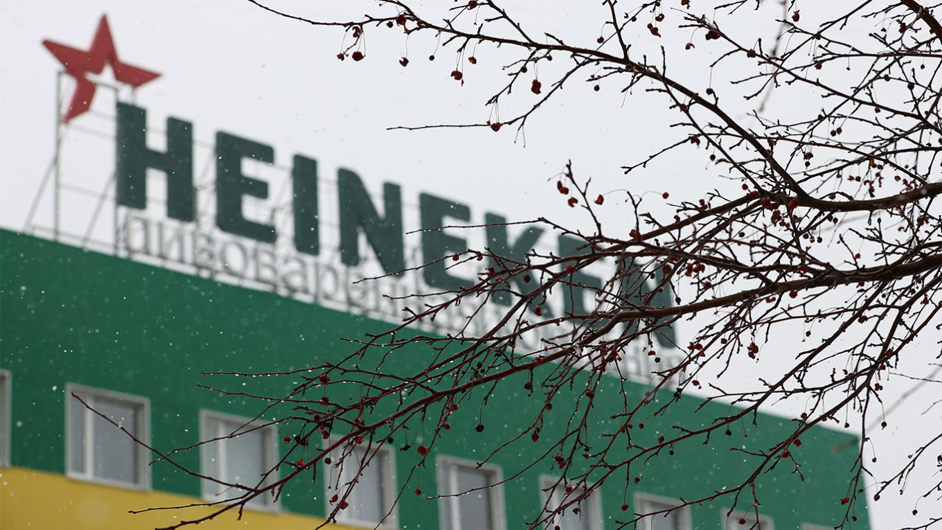 Dutch brewer Heineken sells its Russian operations for 1 euro, taking a  300-million-euro hit
