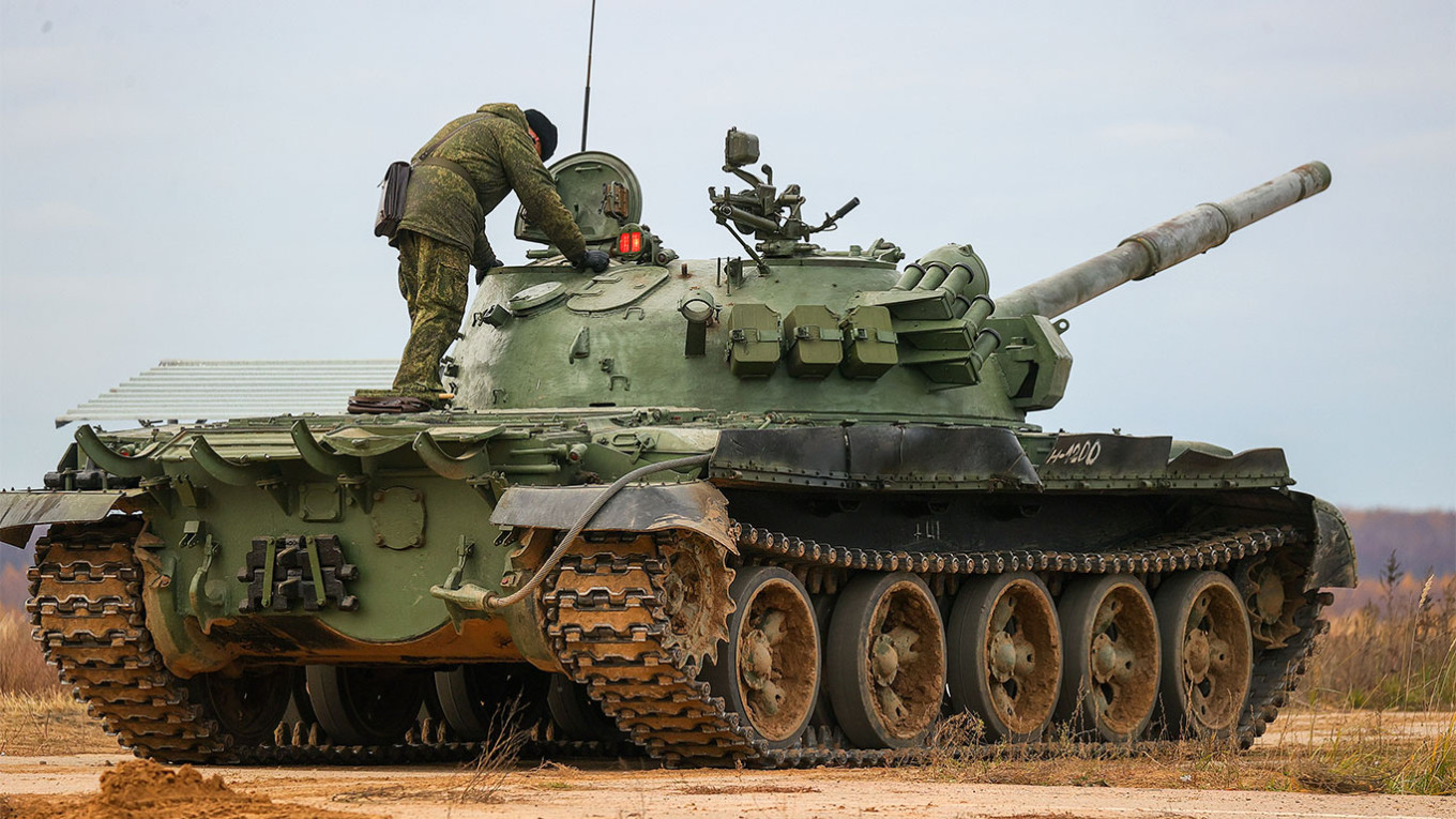 Shot from a tank. Russian tank shot on range. Smoke, explosions